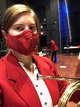 Horn player in Pops concert mask